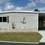 A house exterior with an anchor decoration on the wall.
