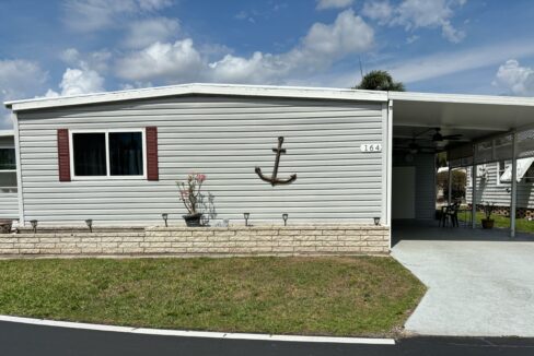 A house exterior with an anchor decoration on the wall.